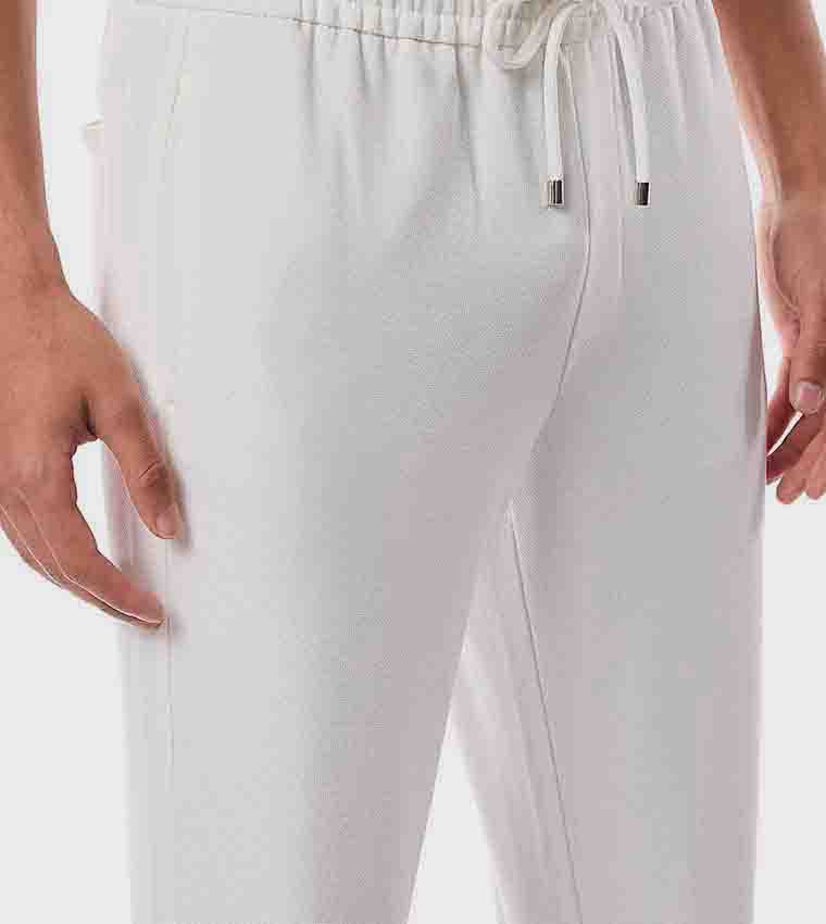 Plain pants with a drawstring waist hover image